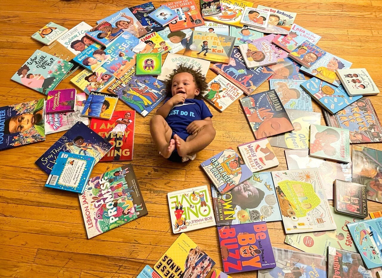 Arin Gentry's son, Kyrin, surrounded by books.