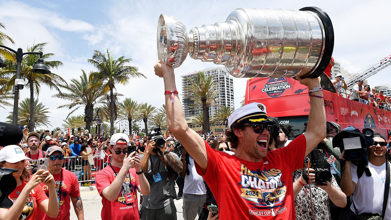 Florida Panthers' Carter Verhaeghe carries the Stanley Cup during the NHL hockey team's Stanley Cup championship celebration, Sunday, June, 22, 2025, in Fort Lauderdale, Fla.