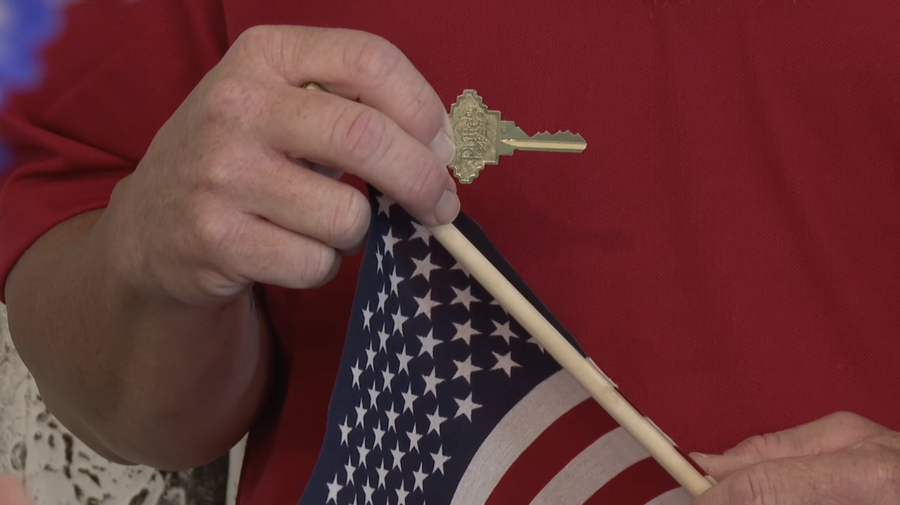 Christopher Liby holding new house key