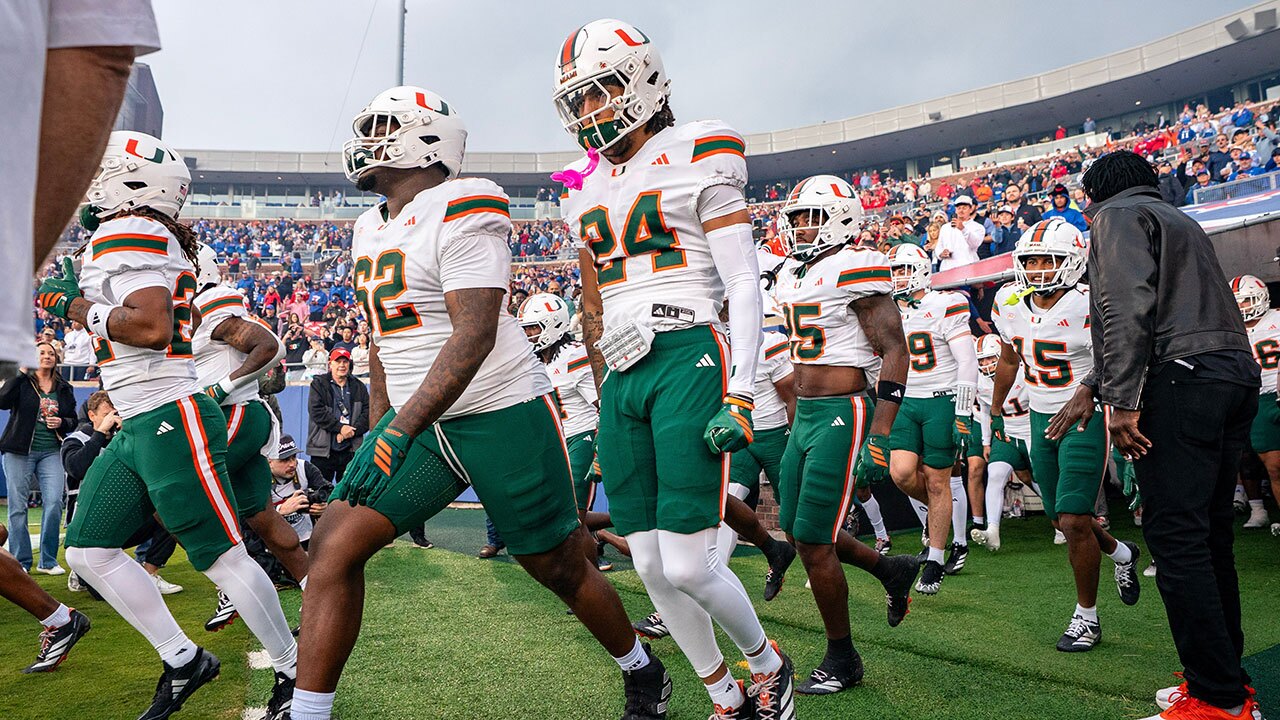 The Miami Hurricanes take the field before an NCAA college football game against SMU, Saturday, Nov. 1, 2025, in Dallas.