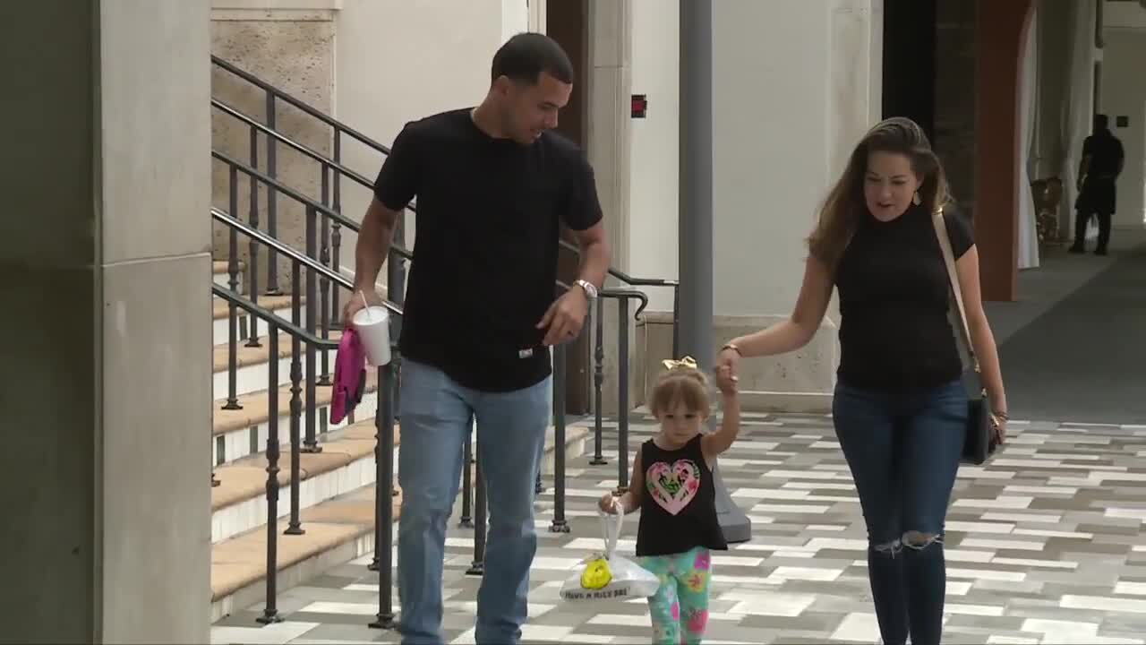 Erica Malagon and family walk through Rosemary Square
