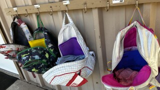 Students' backpacks hang outside a classroom at Aucilla Christian Academy in Monticello as the school continues to grow enrollment.