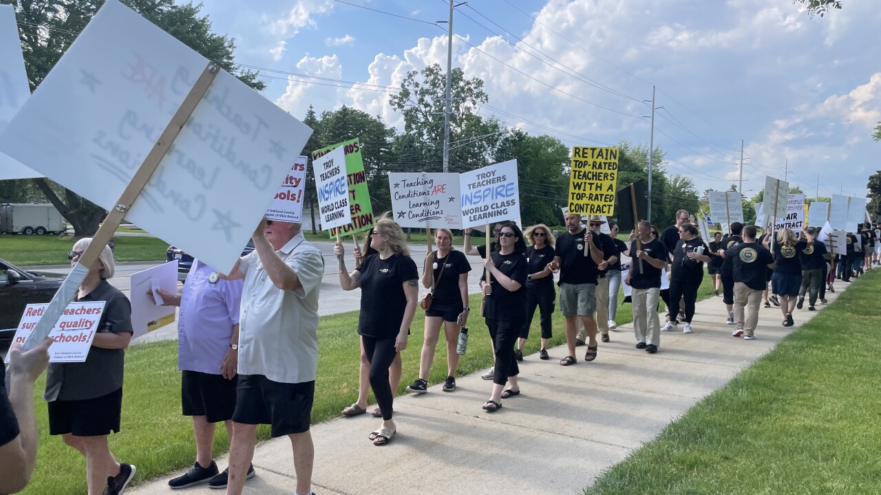 150+ teachers and parents with the Troy School District picketing outside the school administration building