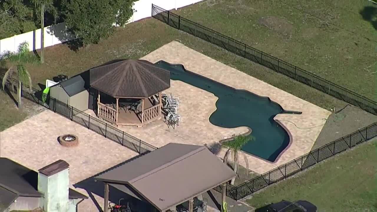 Closeup of pistol-shaped swimming pool in backyard of Florida home, Feb. 17, 2023