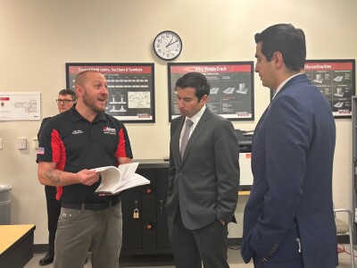 Evans tours Aims Community College