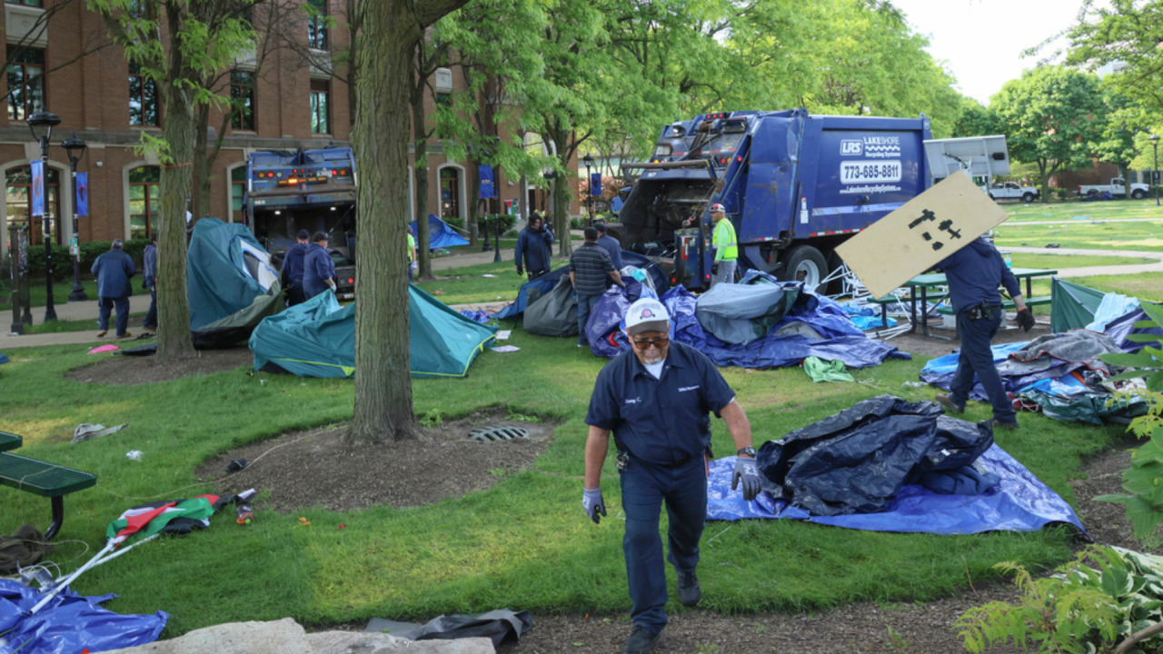 University of Chicago employees clear out a pro-Palestinian encampment after police closed off the area