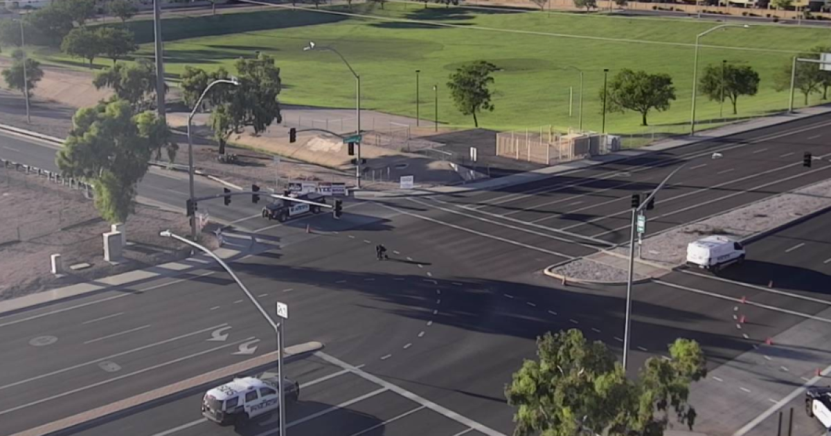 Gunfire involving 2 vehicles leaves 1 injured, shuts down Mesa intersection