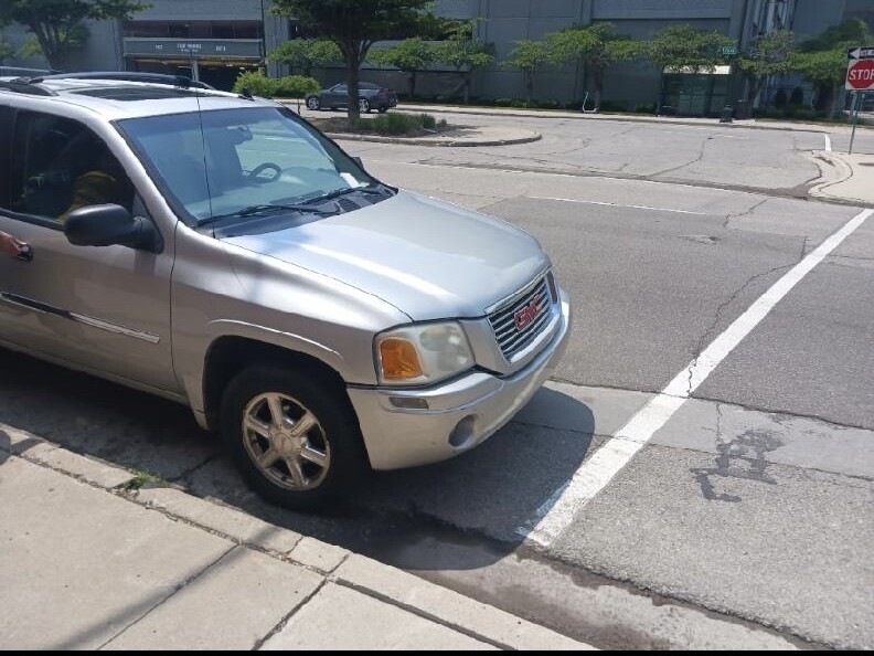 Deon's silver 2008 GMC Envoy, the vehicle also has an honor roll sticker on the back with a silver ramp attached