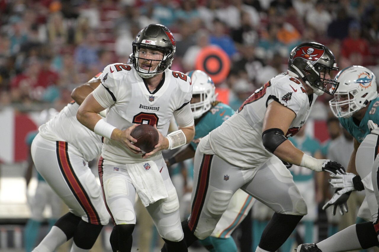 Tampa Bay Buccaneers QB Kyle Trask rolls out against Miami Dolphins in preseason game, Aug. 13, 2022