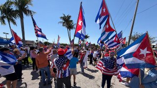 A few dozen people held a rally in support of regime change in Cuba on March 22, 2026, in West Palm Beach, right along the route President Donald Trump uses to get to Palm Beach International Airport.