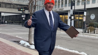 Larry Householder giving a thumbs up before going into his second day of trial