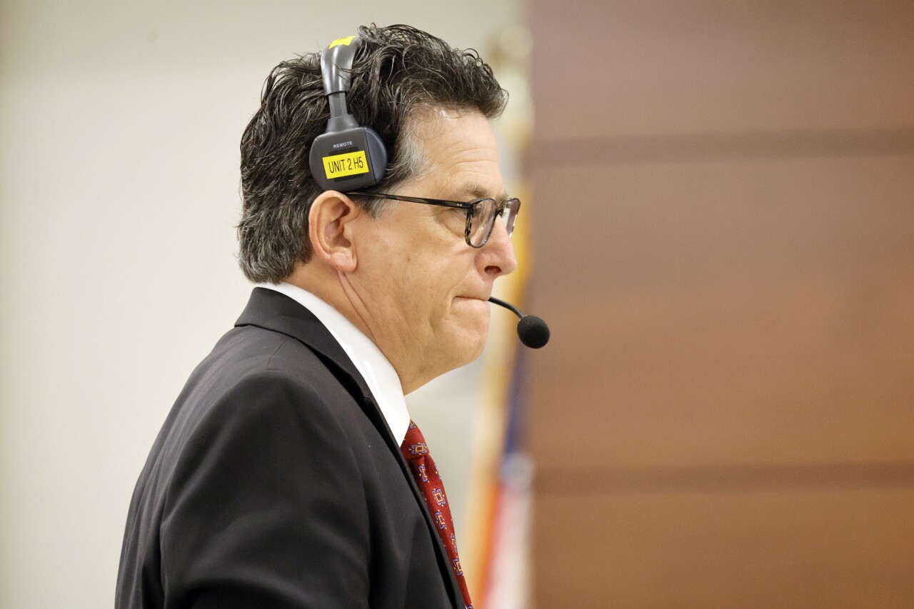 Assistant State Attorney Jeff Marcus wearing headsets in court, July 6, 2022