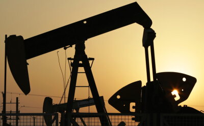  In this Sept. 30, 2015, file photo, oil pumps work in the desert oil fields.