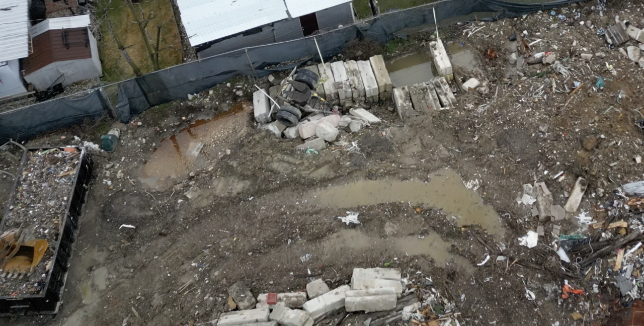 Pools of stagnant water on the work site next to Village Green mobile homes