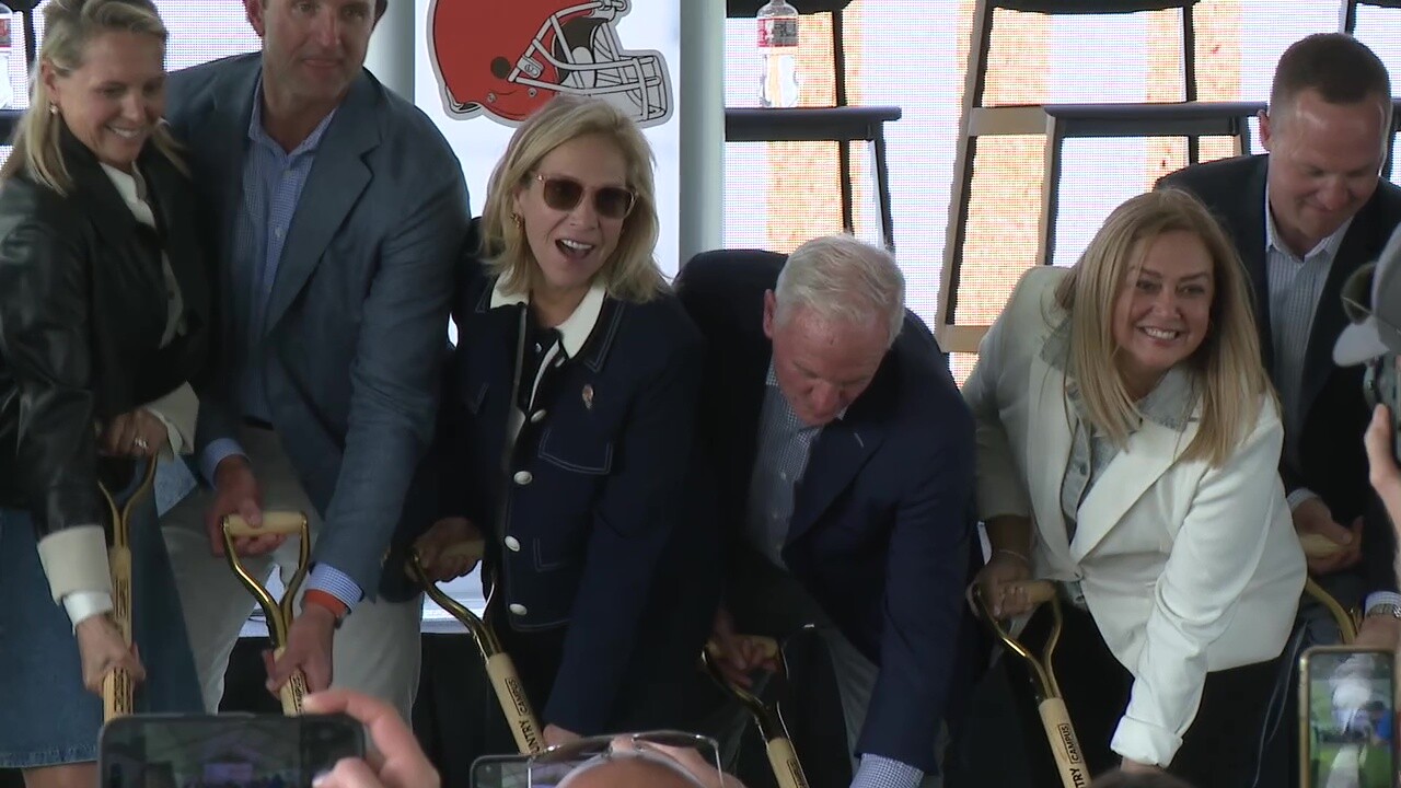 Browns owners Dee and Jimmy Haslam, center, participate in a ceremonial groundbreaking for a mixed-use project next to the team's headquarters in Berea.