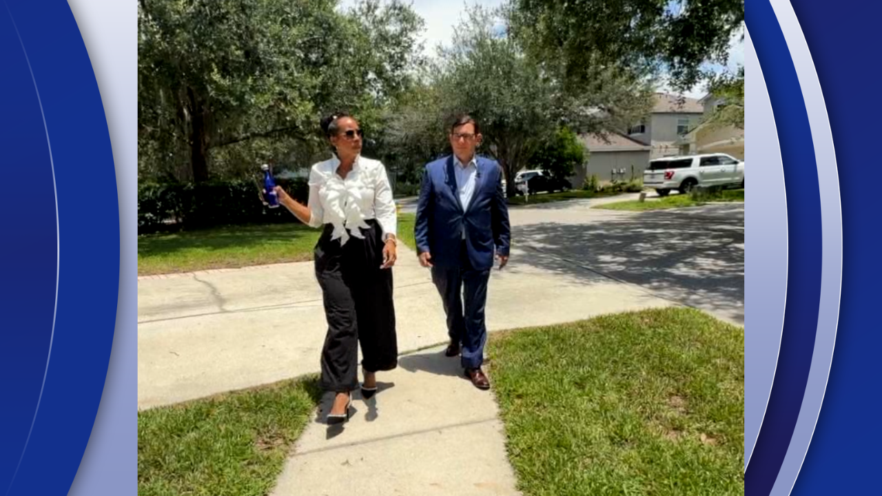 Shonia Cruz Munoz shows Adam Walser around the Creek View neighborhood in Riverview
