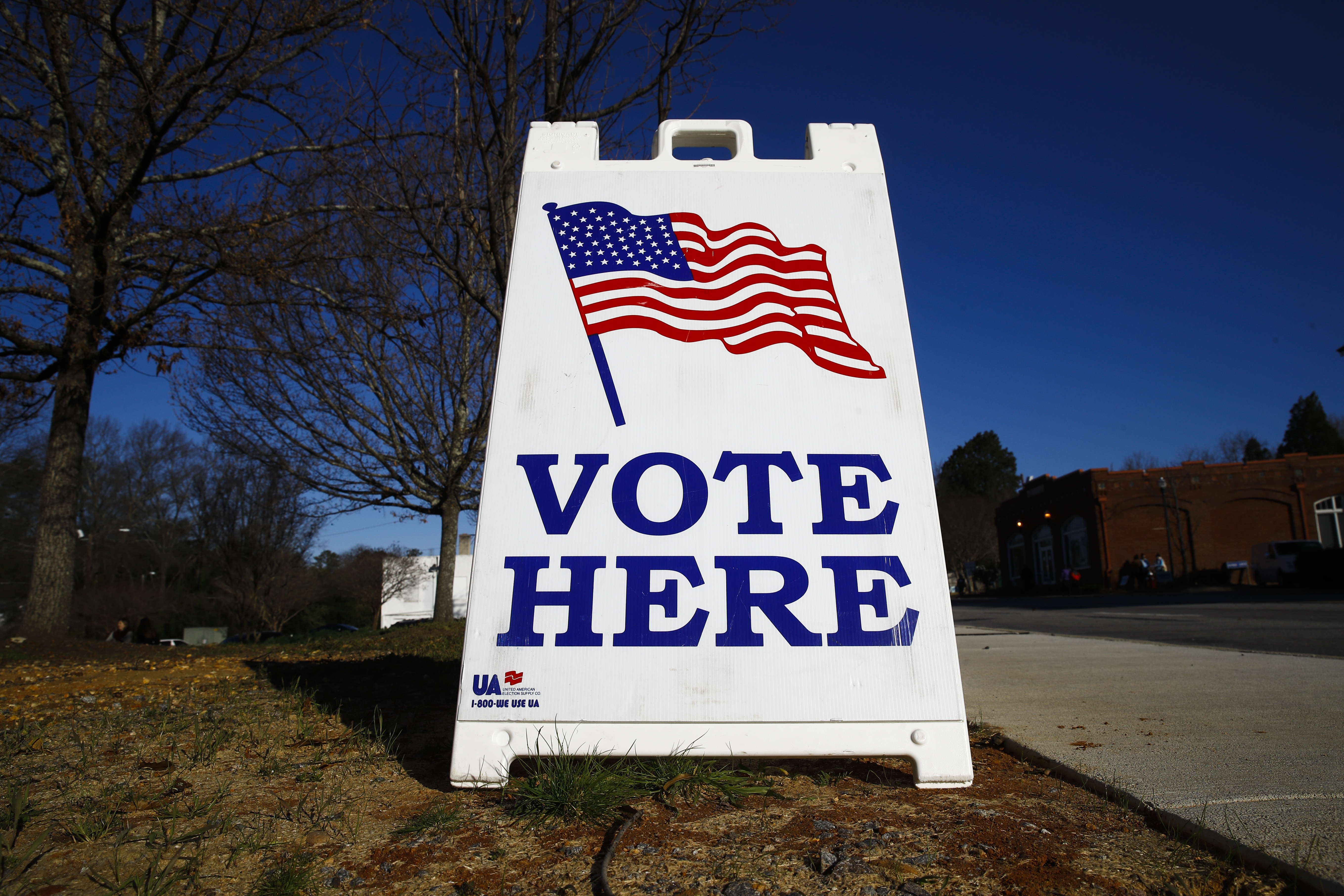 A "vote here" sign.