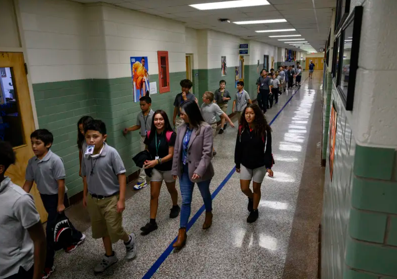 Bonham Middle School students walk between classes on Sept. 13, 2023 in Odessa.