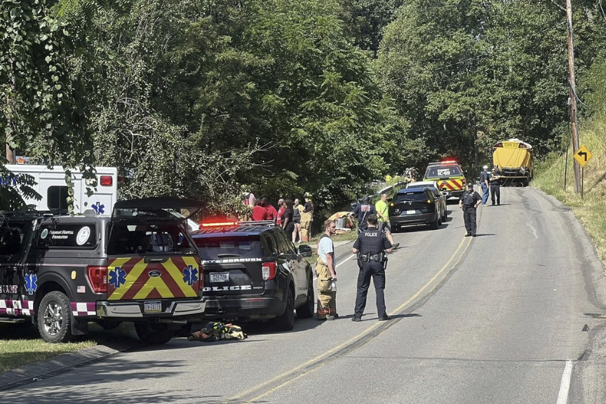 Emergency personnel work at the site of a crash of a bus carrying members of the Aliquippa Junior High School football team in Economy Bourough, Pa., on Saturday, Aug. 23, 2025. 