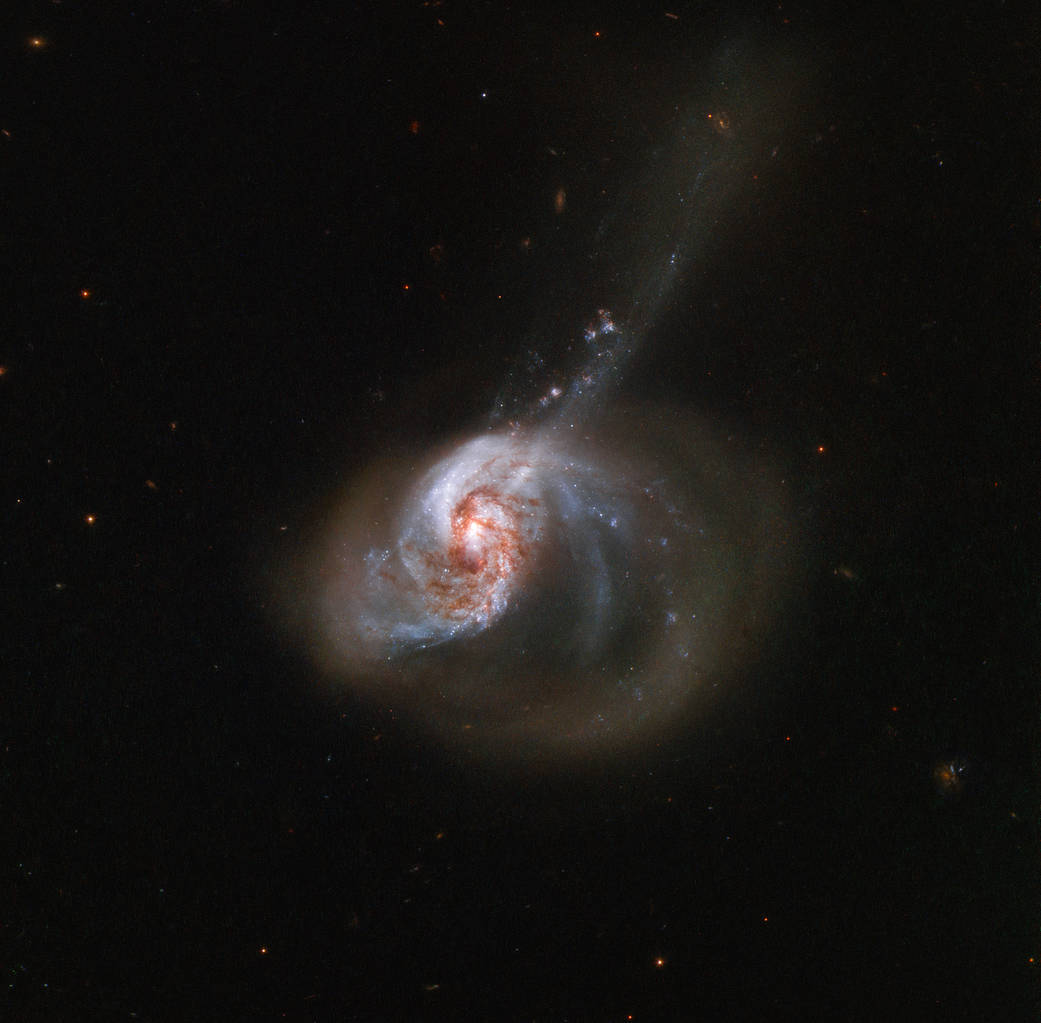 Two galaxies swirl together in cosmic collision captured by Hubble