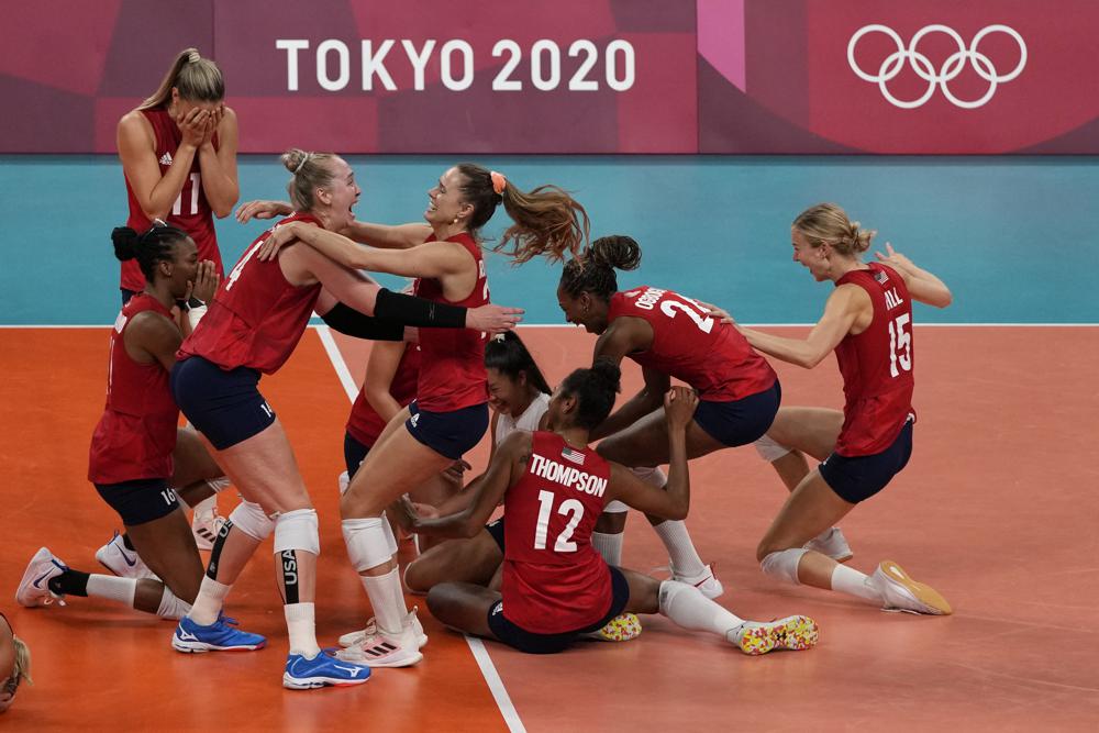 Players from the United States react after defeating Brazil to win the gold medal in women's volleyball at the 2020 Summer Olympics, Sunday, Aug. 8, 2021, in Tokyo, Japan