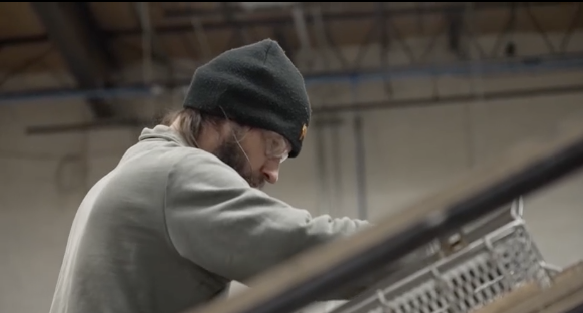 A person working with metal.