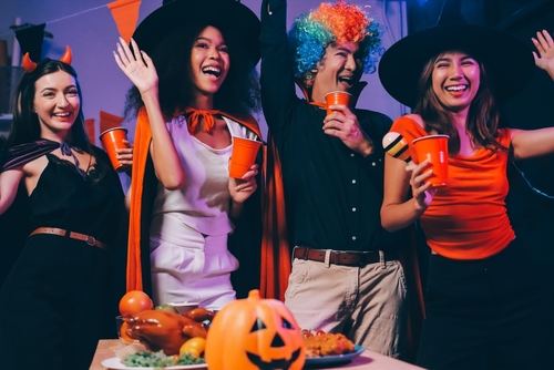 Stock image of an office Halloween party.