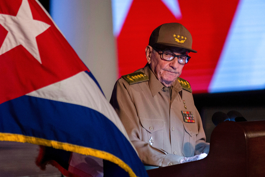 FILE - Former Cuban President Raul Castro looks at the Cuban flag during his speech at the event celebrating the 65th anniversary of the triumph of the revolution in Santiago, Cuba, Jan. 1, 2024. 