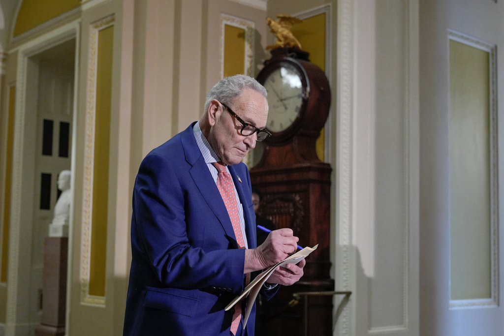 Sen. Minority Leader Chuck Schumer of N.Y., takes notes during a news conference after a policy luncheon on Capitol Hill, Tuesday, Feb. 3, 2026, in Washington. 