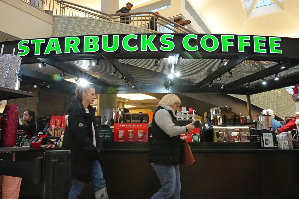 Shoppers at the Walden Galleria in Buffalo, NY, stop by the Starbucks kiosk on Saturday, Nov. 30, 2024. 