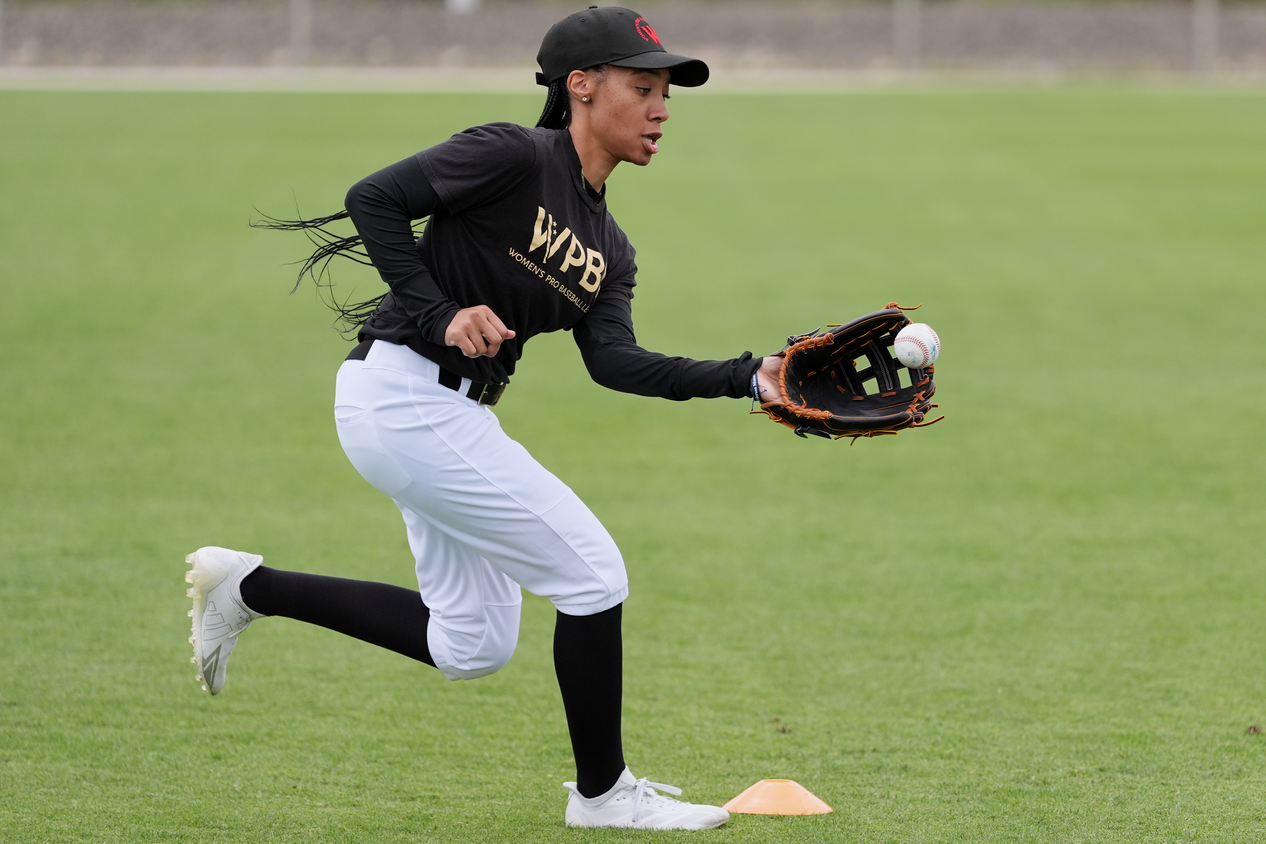 FILE - Mo'ne Davis fields a ball during a Women's Pro Baseball League (WPBL) practice, Wednesday, March 18, 2026, in Fort Myers, Fla. 