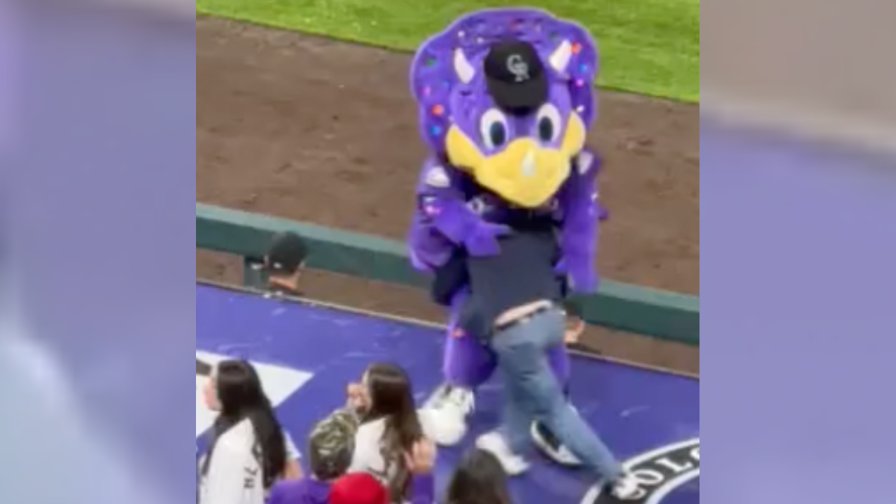 Dinger tackled during Rockies game