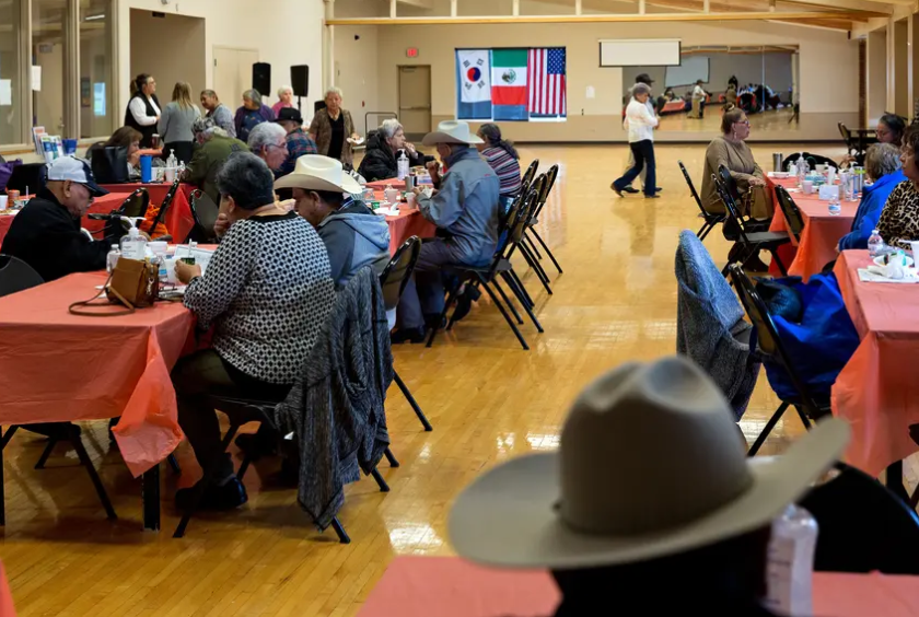 Older Dallas residents eat and dance at the Jaycee-Zaragoza Recreation Center in West Dallas on Nov. 4, 2021. 