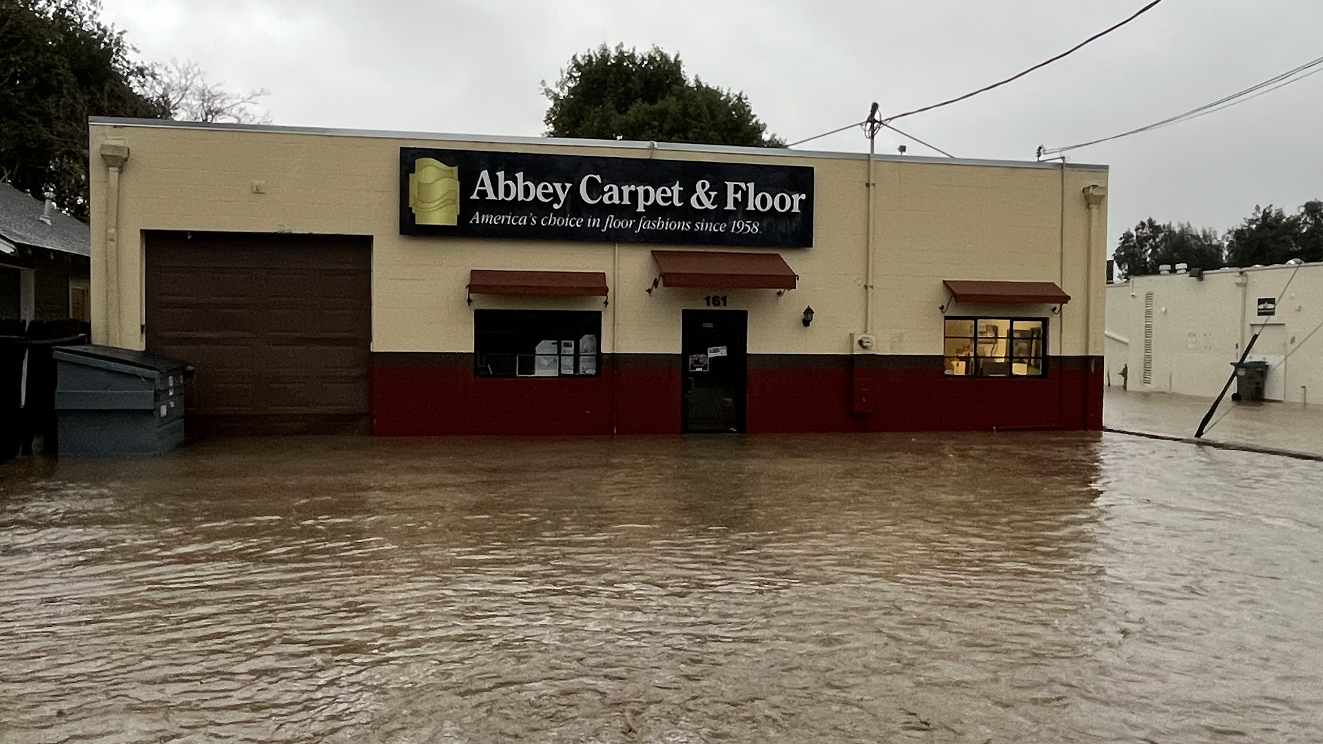 The owner of Abbey Carpet and Floor said about a foot of water and mud rushed into his business destroying his show room and inventory.