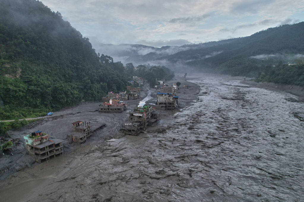 A drone view of the aftermath of flash flooding along the Trishuli river amidst fresh water surge warning in the Trishuli Bazaar area of Nuwakot district, Nepal, Sunday, Aug. 30, 2026. 