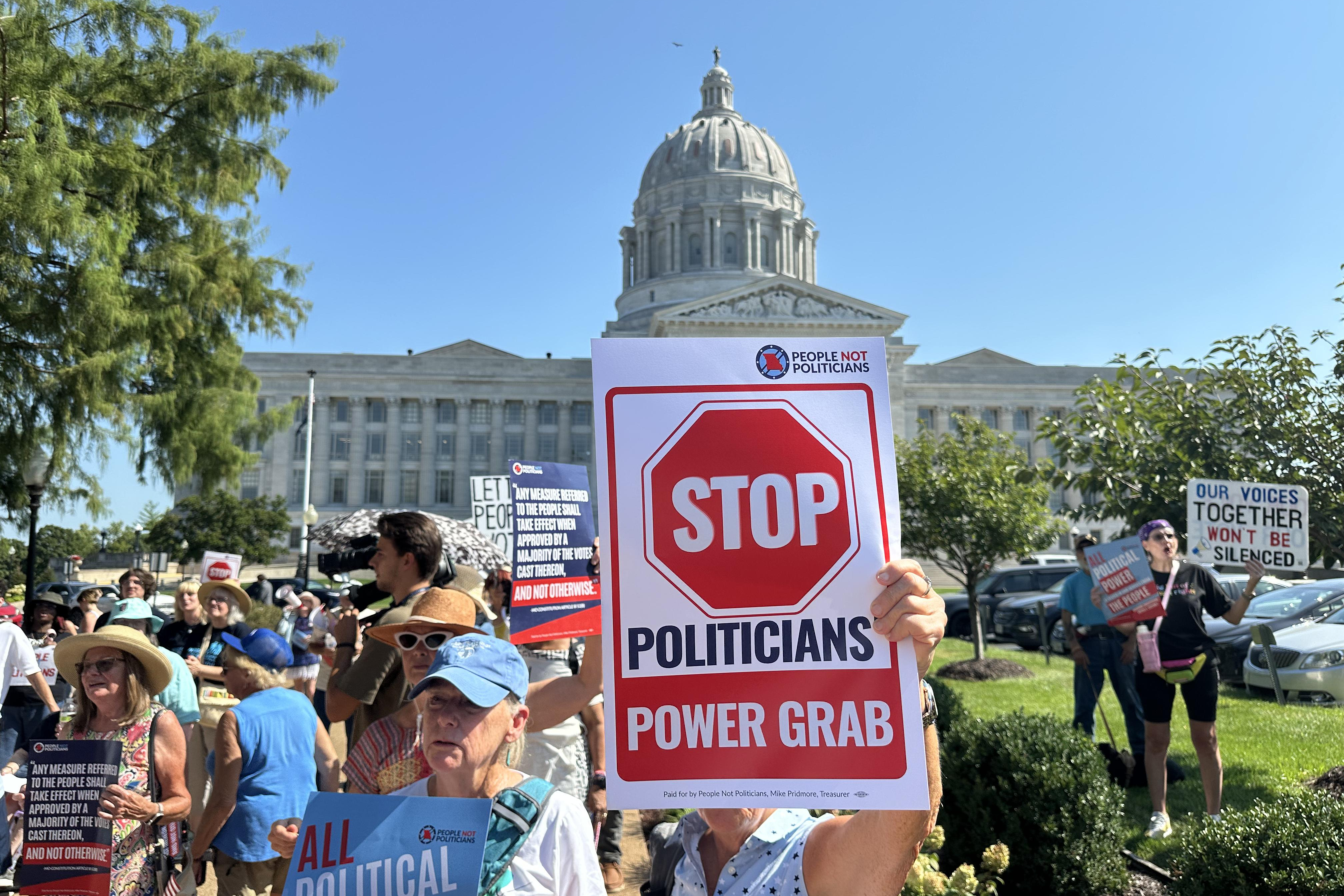 In this photo taken with a smartphone, people opposed to a congressional redistricting plan rally outside the Missouri Capitol in Jefferson City, Mo., Wednesday, Sept. 2, 2026. 