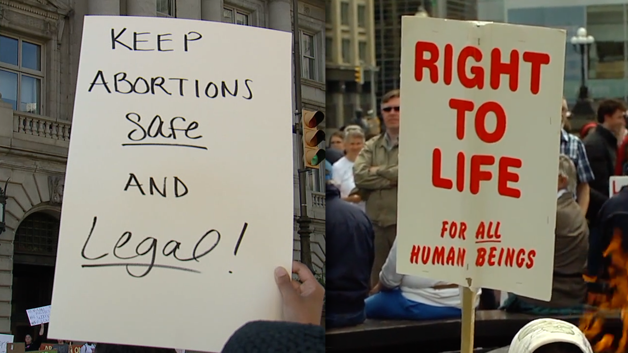 Pro-abortion and anti-abortion signs