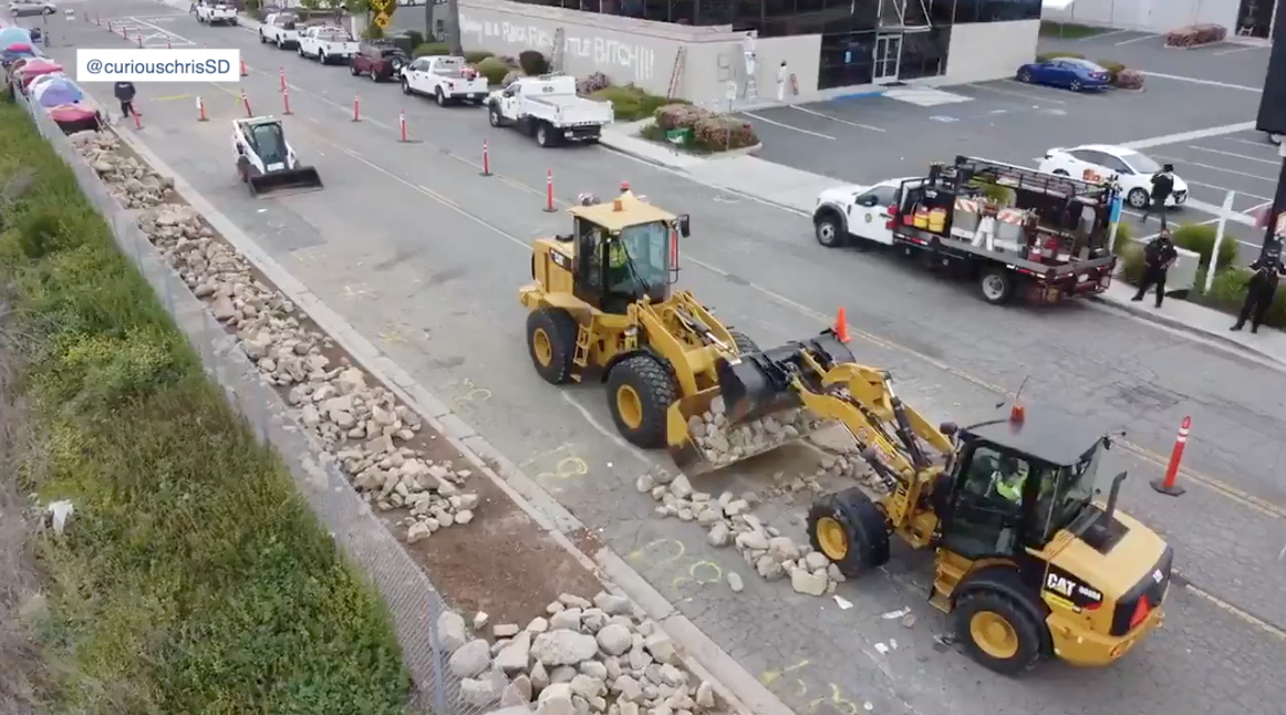 Oceanside crews leave rocks over cleared homeless encampment.png
