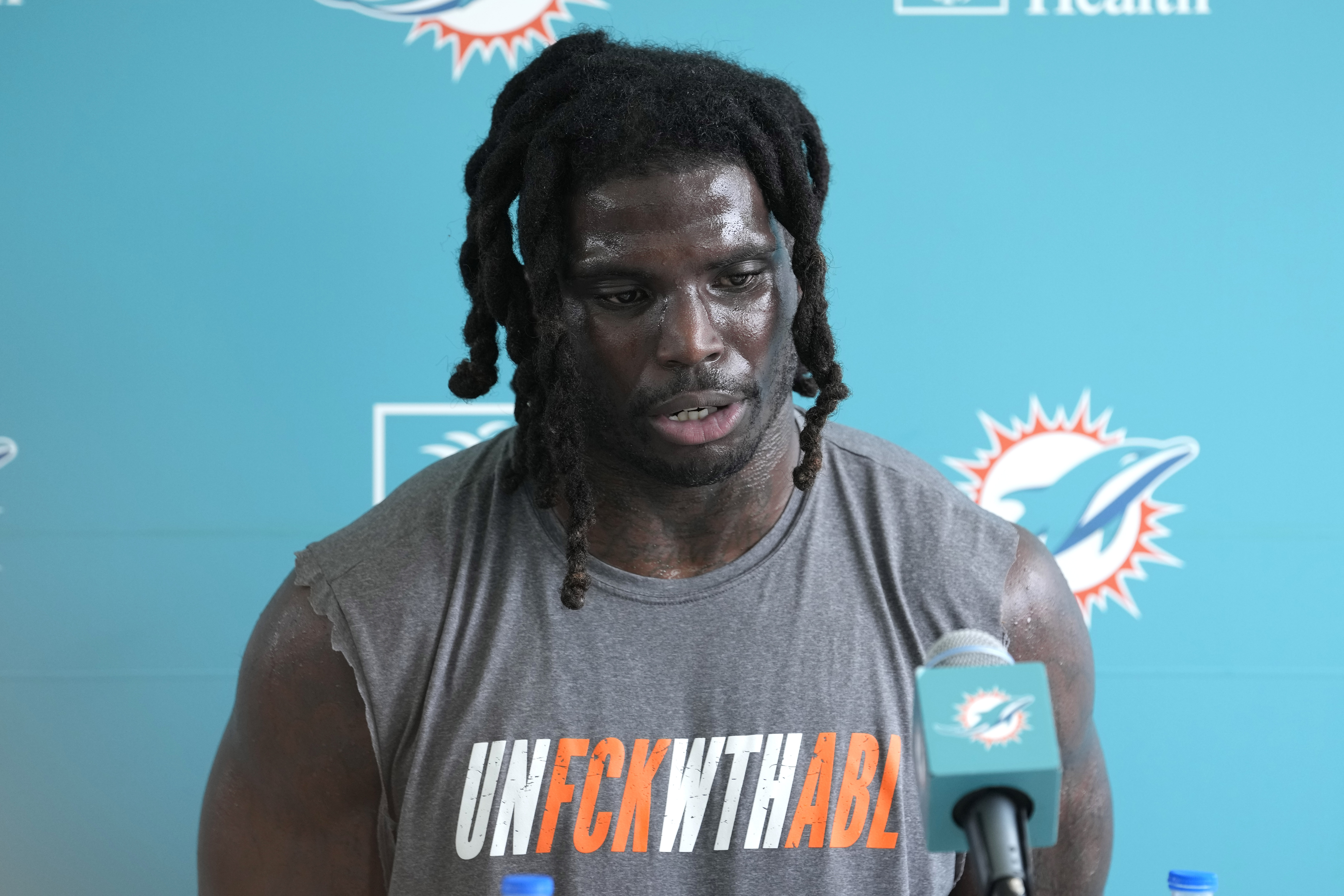 Miami Dolphins receiver Tyreek Hill speaks with reporters after training camp, July 26, 2023