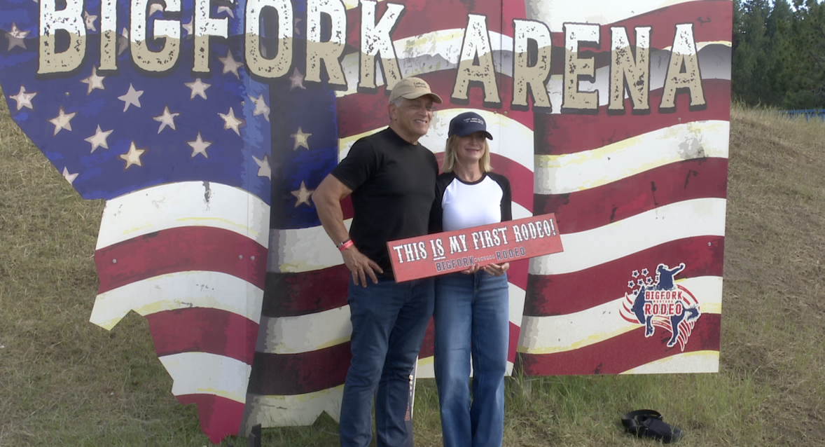 Two fans pose in front of the Bigfork Arena sign, Wednesday, July 9, 2026