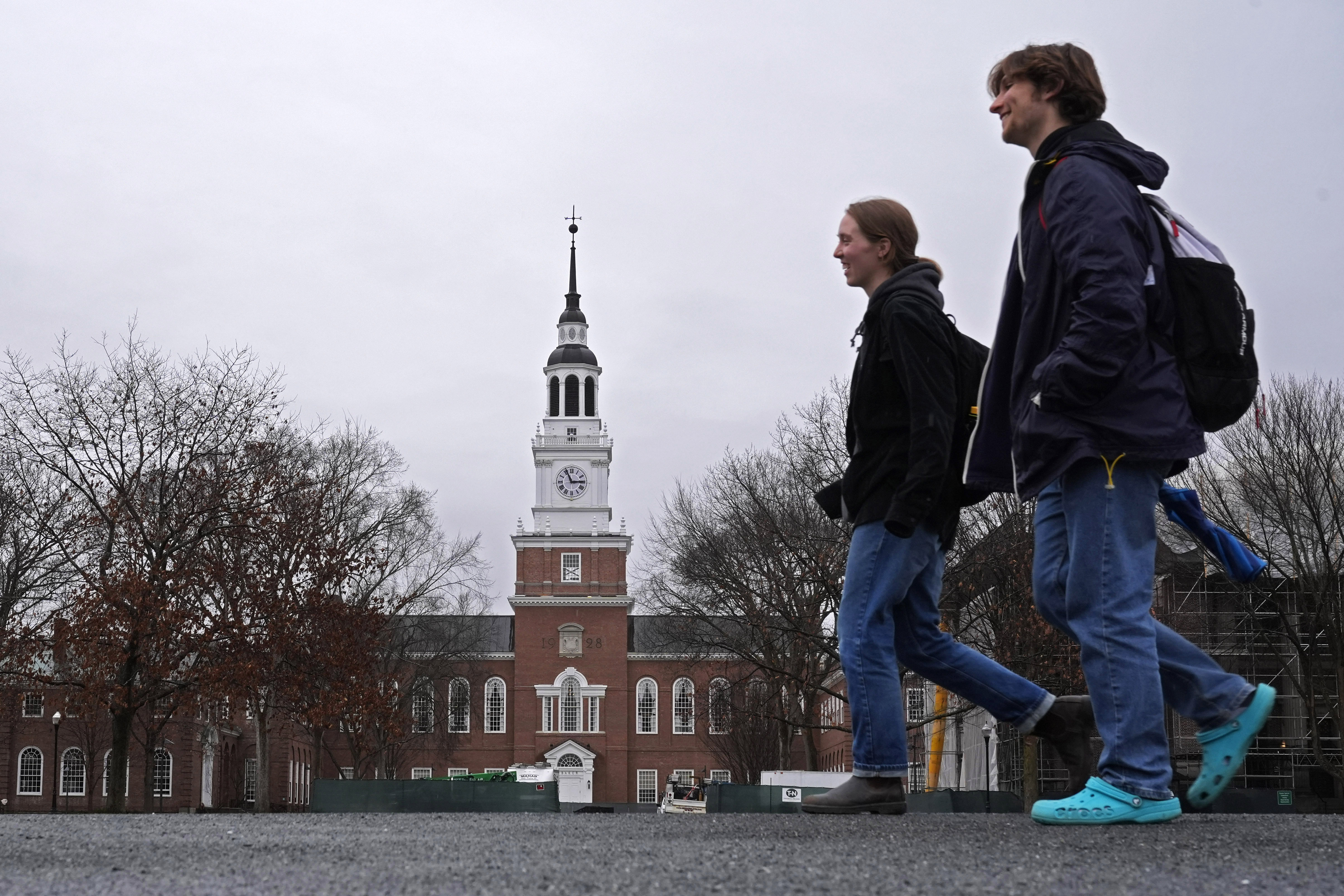 FILE - Students cross the campus of Dartmouth College, March 5, 2024, in Hanover, N.H.