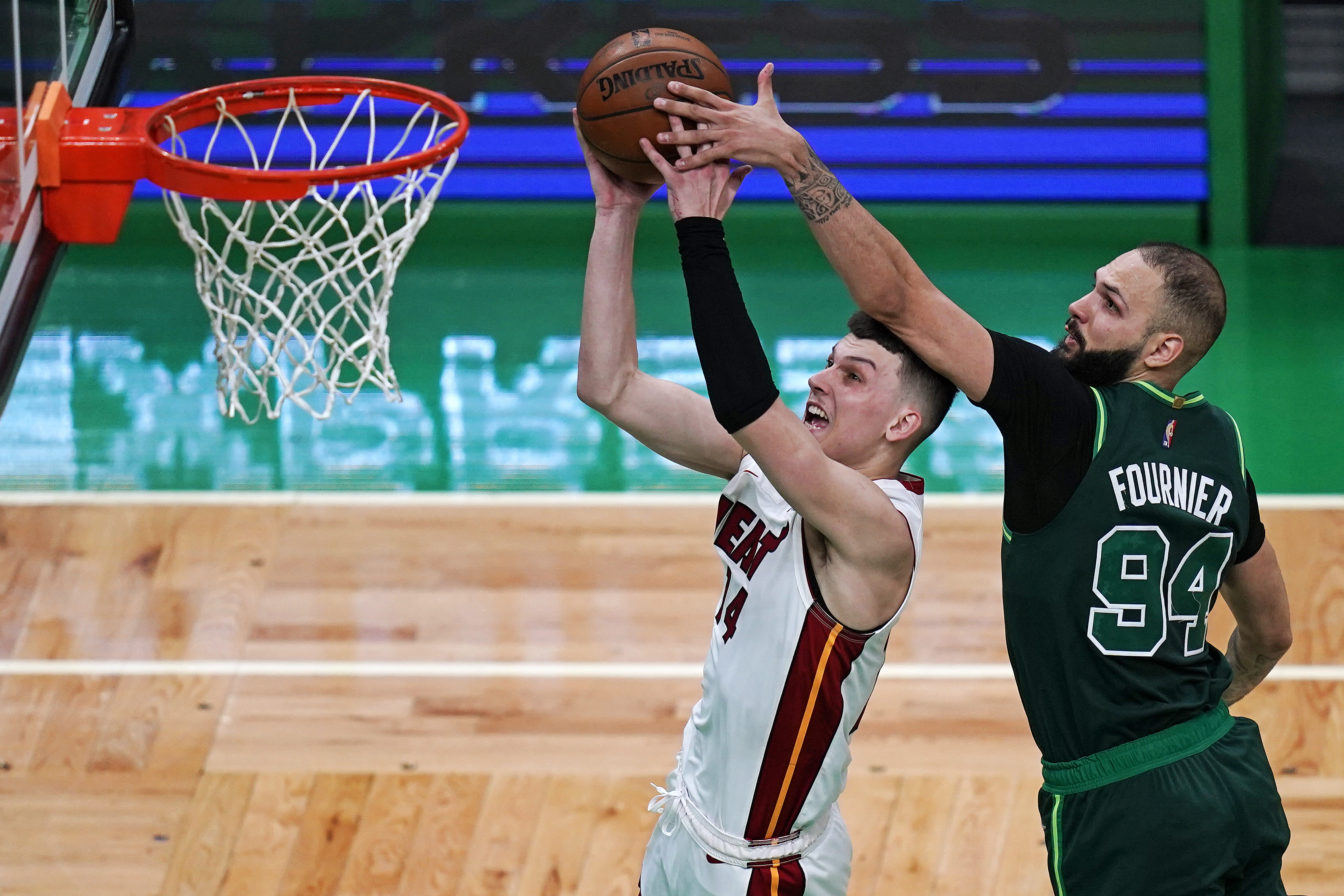 Boston Celtics guard Evan Fournier tries to block Miami Heat guard Tyler Herro, May 11, 2021
