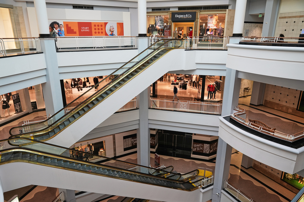 People walk through a shopping mall in Towson, Md., Wednesday, Dec. 10, 2025. 