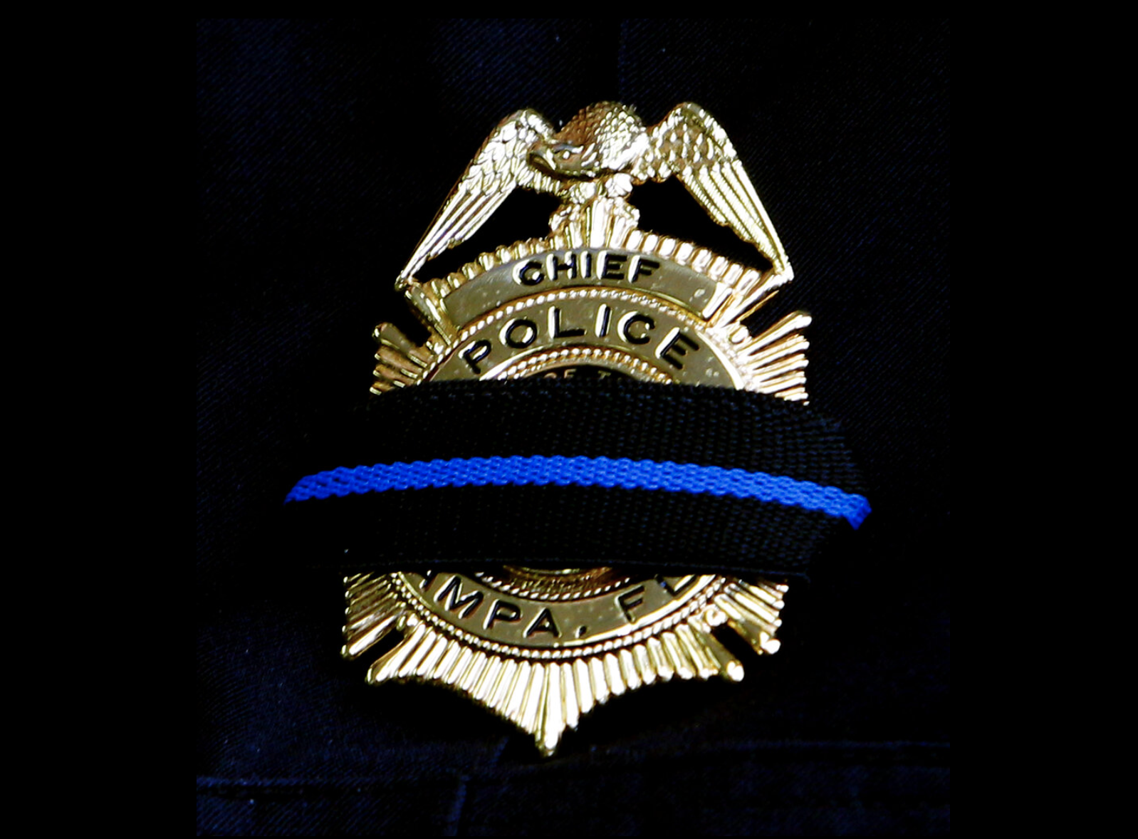Police officer badge, black bar, fallen officer