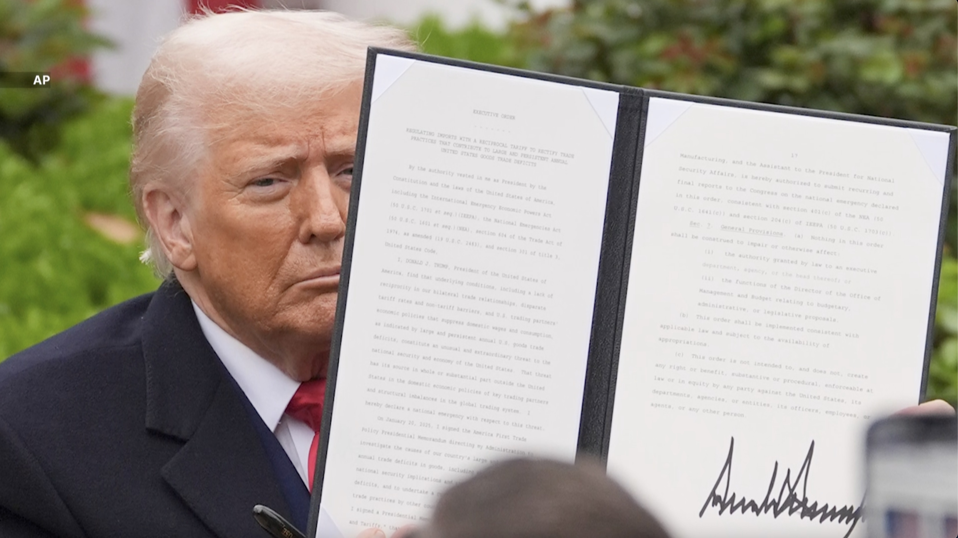 President Trump signs order on tariffs.