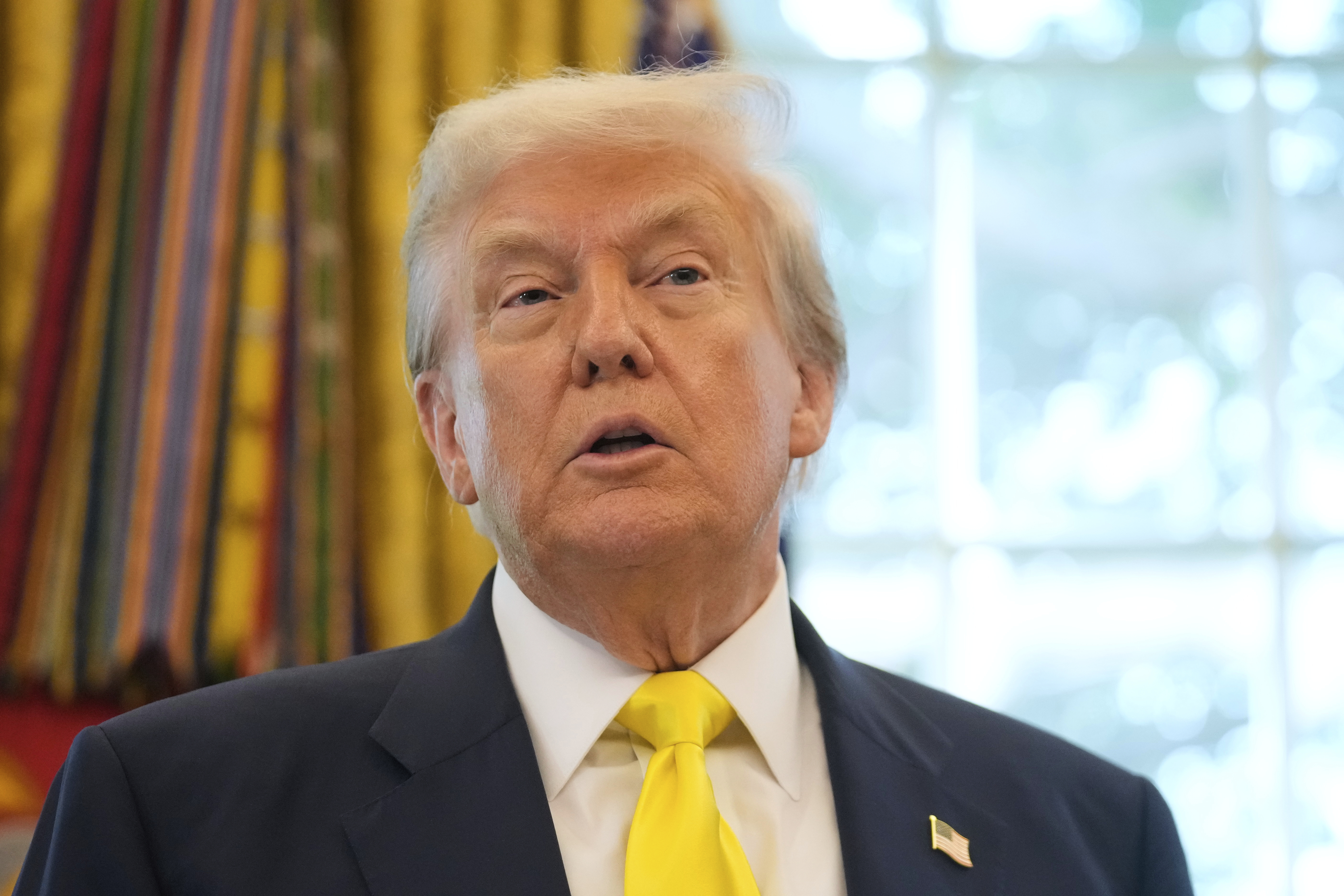 President Donald Trump speaks about the economy in the Oval Office of the White House, Thursday, Aug. 7, 2025, in Washington. 