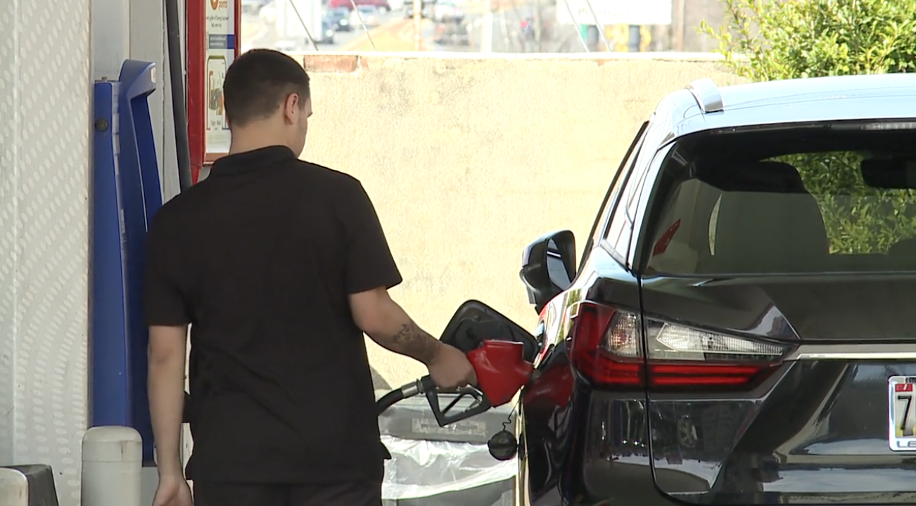 Driver filling up his gas tank at an Exxon in Towson