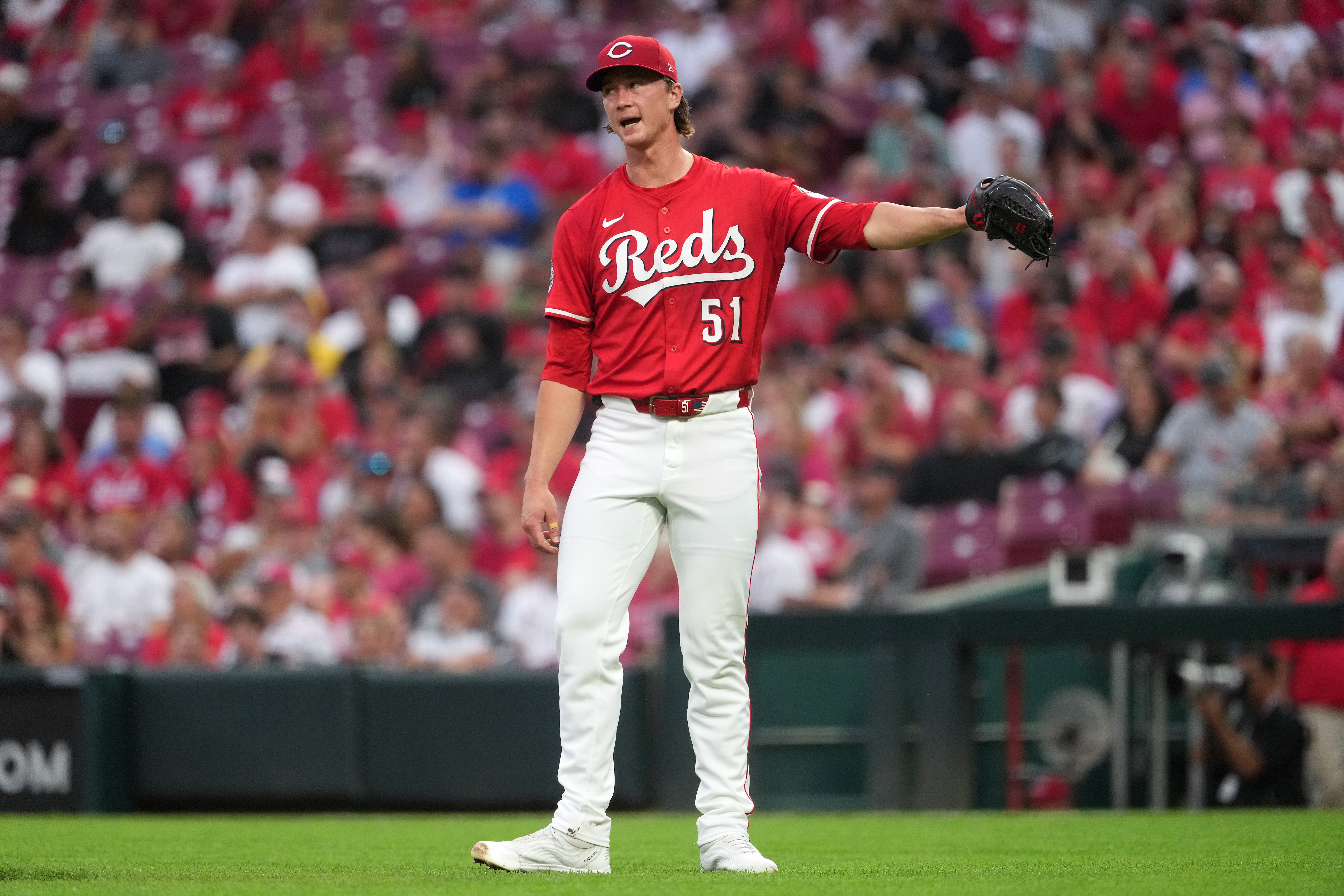 Cincinnati Reds' Brady Singer reacts after surrendering a two-run home run in the second inning of a baseball game against the Pittsburgh Pirates, Tuesday, Sept. 23, 2025, in Cincinnati. (AP Photo/Kareem Elgazzar)