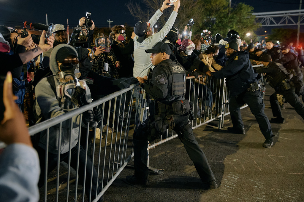 Police try to hold the line as protesters push the fences outside the Delaney Hall detention center during a protest against the transfer of detainees and federal immigration policies on Saturday, May 30, 2026, in Newark, N.J.