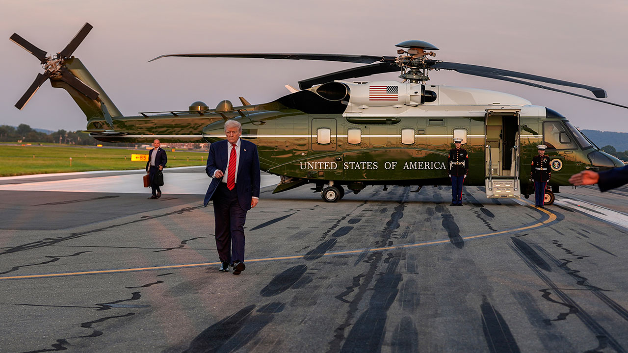 President Donald Trump walks from Marine One to speak with reporters at Lehigh Valley International Airport, Sunday, Aug. 3, 2025, in Allentown, Pa.
